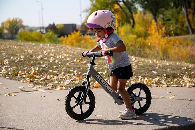 Strider 12” Sport Bike - No Pedal Balance Bicycle for Kids 1 to 4 Years - Includes Safety Pad, Padded Seat, Mini Grips & Flat-Free Tires - Tool-Free Assembly & Adjustments