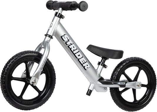 Strider 12” Pro Bike, No Pedal Balance Bicycle for Kids 1 to 4 Years - Includes Safety Pad, Padded Seat, Mini Grips & Flat-Free Tires - Tool Free