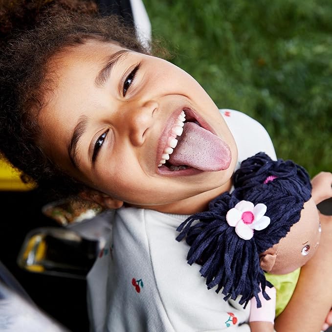 HABA Cari 12" Black Baby Doll with Black Pigtails, Embroidered Face, Removable Green Dress, Machine Washable Soft Baby Doll - 18 Months+