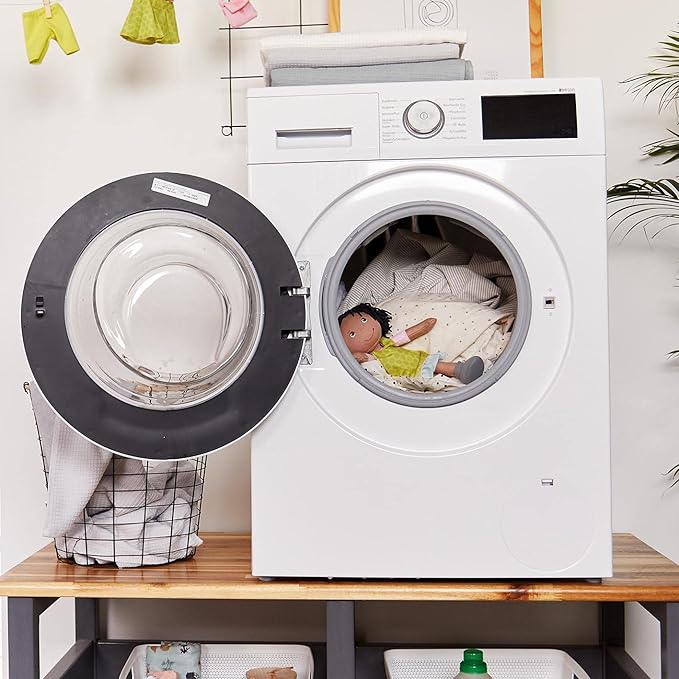 HABA Cari 12" Black Baby Doll with Black Pigtails, Embroidered Face, Removable Green Dress, Machine Washable Soft Baby Doll - 18 Months+