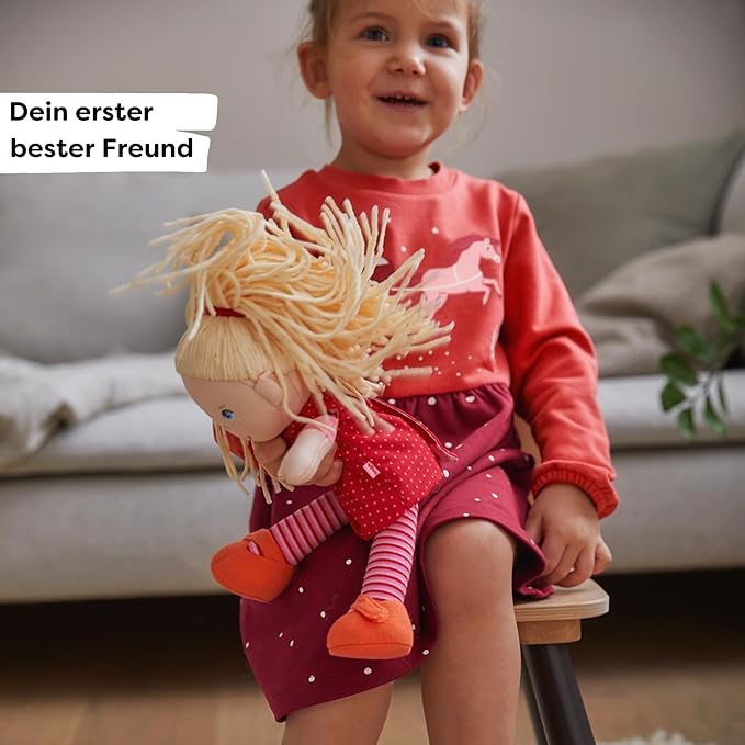 HABA 12" Soft Baby Doll Annelie with Blonde Hair, Embroidered Face, Removable Red Dress and Matching Hairband - Washable Toddler Doll for 18 Months+