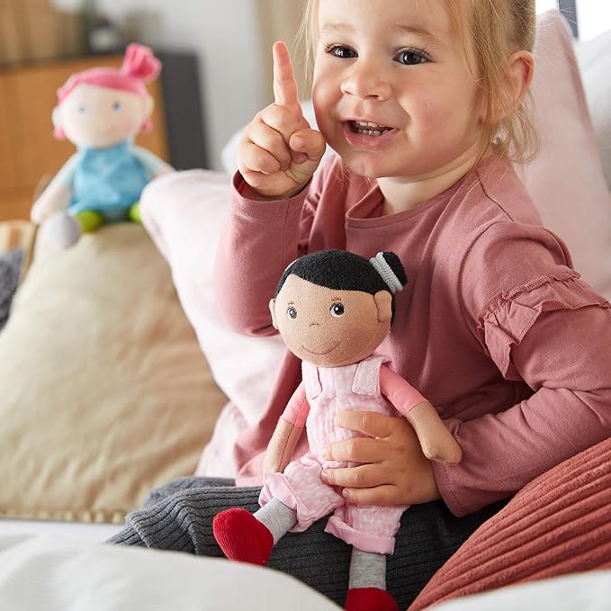 HABA Snug Up Doll Rumbi - 10" Soft Doll with Black Hair and Pink Overalls - Machine Washable for 18 Months and Up