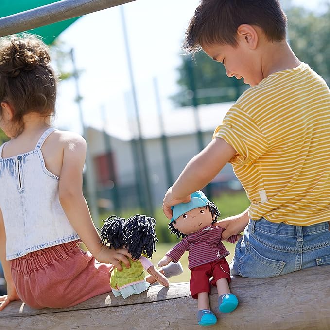 HABA Cari 12" Black Baby Doll with Black Pigtails, Embroidered Face, Removable Green Dress, Machine Washable Soft Baby Doll - 18 Months+